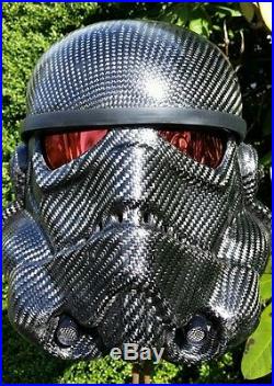 Carbon fiber stormtrooper helmet. The other guy's helmet is wrapped. FAKE