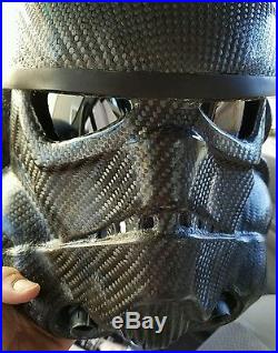 Carbon fiber stormtrooper helmet. The other guy's helmet is wrapped. FAKE